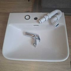 Basin with tap