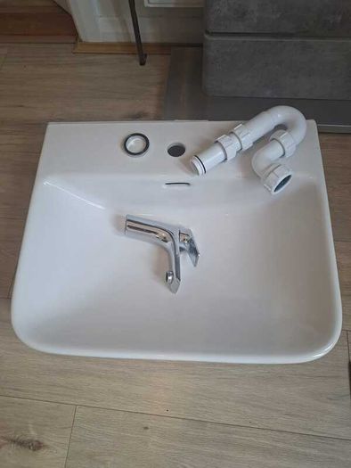 Basin with tap