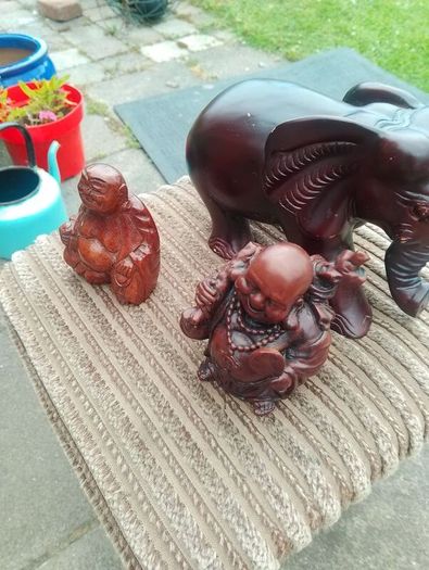 carved wooden elephant and 2 Buddha