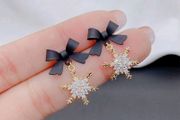 Black bow Christmas earrings