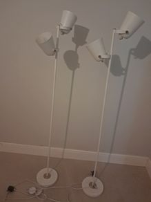 Two white floor lamps
