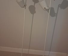 Two white floor lamps