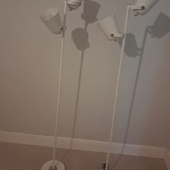 Two white floor lamps