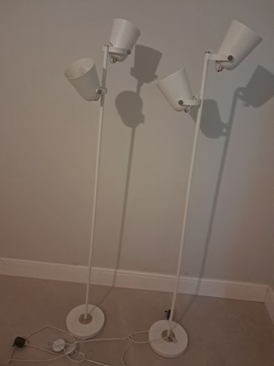 Two white floor lamps
