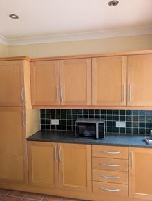 Entire Kitchen including Neff Double Oven, Integrated Fridge-Freezer, Bosch Dishwasher,  Faber Extractor fan, and Microwave.