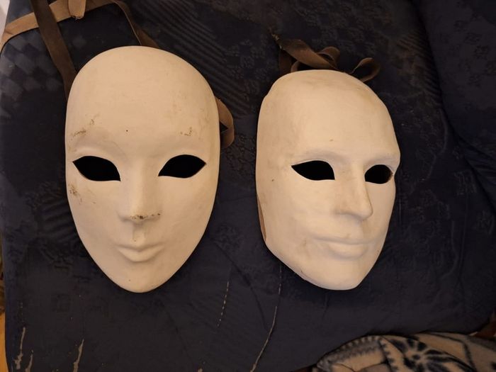 Pair of vintage Masquerade masks, with ribbons to bind them.