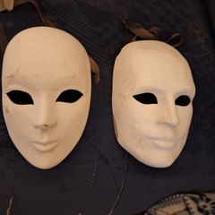 Pair of vintage Masquerade masks, with ribbons to bind them.