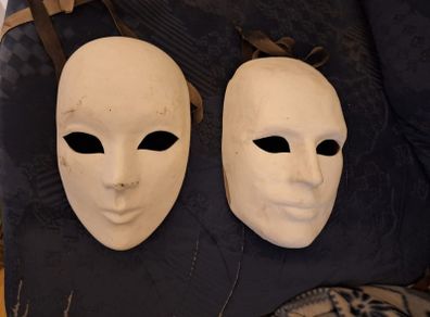 Pair of vintage Masquerade masks, with ribbons to bind them.
