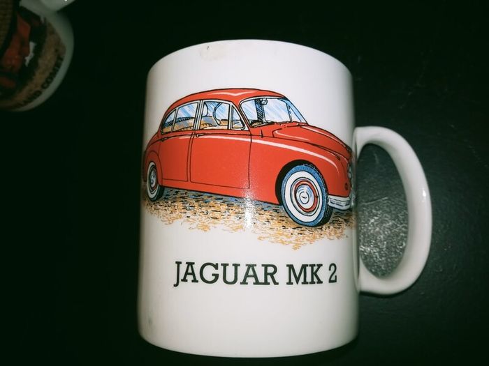 collection of six automotive mugs