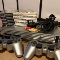 PlayStation 2 with controllers + games
