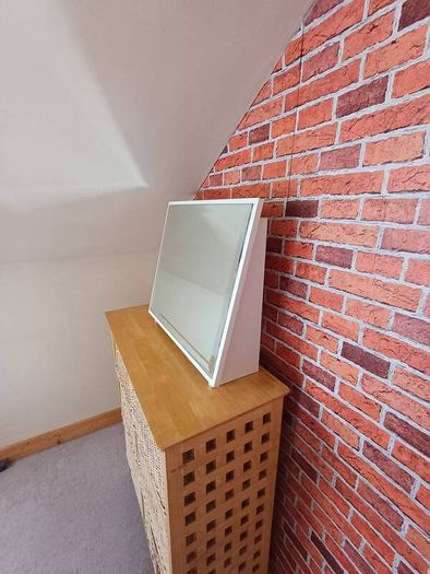 Wooden surround mirror.   Free standing
