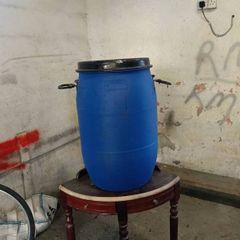 Blue plastic barrells,