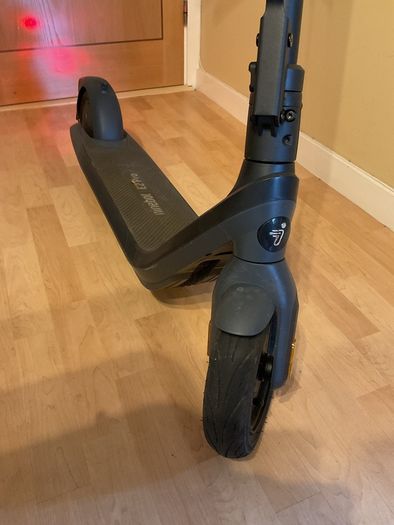 Ninebot E2 scooter with a helmet