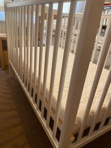 White cot and changer