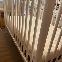 White cot and changer