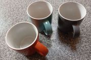 Three large coloured mugs