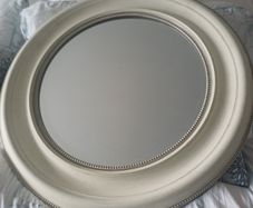 Cream round mirror