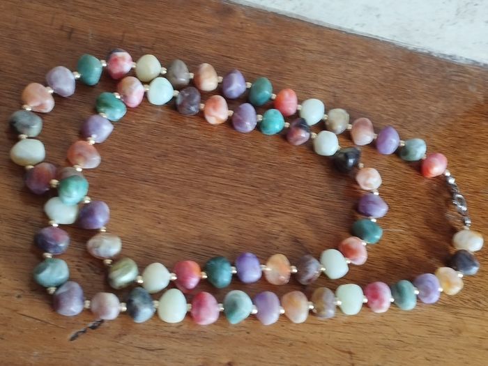 Necklace of multicolored artificial stones.
