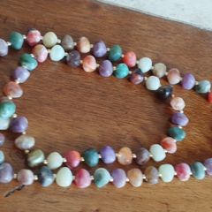 Necklace of multicolored artificial stones.