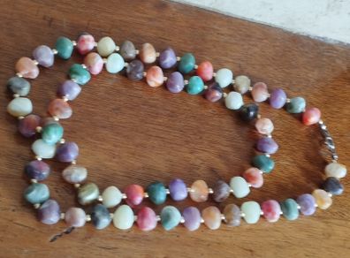 Necklace of multicolored artificial stones.