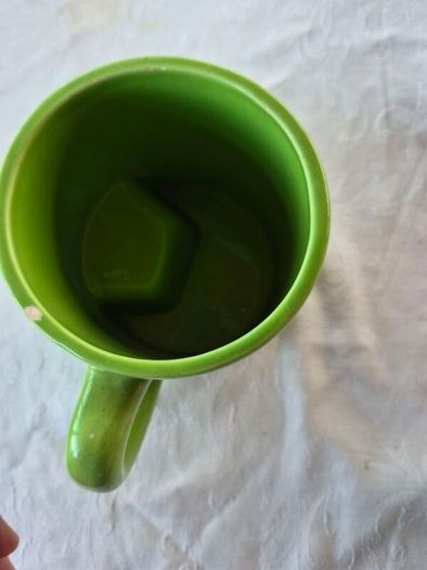 A novelty flick football interactive coffee mug