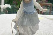 Vintage Nao porcelain figurine titled Girl with Hoop