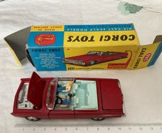 Corgi. Chrysler Imperial 246. With golf cart, driver snd passenger. Car and box are mint condition.