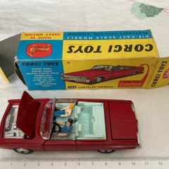 Corgi. Chrysler Imperial 246. With golf cart, driver snd passenger. Car and box are mint condition.