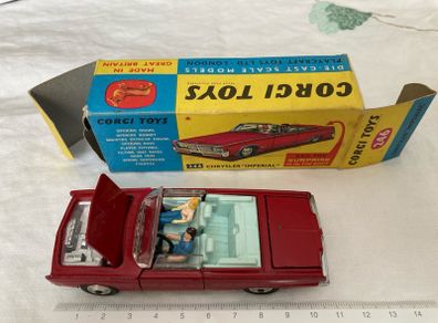 Corgi. Chrysler Imperial 246. With golf cart, driver snd passenger. Car and box are mint condition.