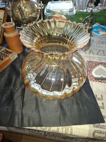 A Beautiful Amber Glass Oil Lamp Shade featuring a bulbous, ribbed body and a wide, ruffled, fluted rim, Postage Available