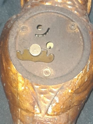 Cold Painted Bronze Clock In Form Of An Owl. The Decorative Dial Sits In The Owls Belly And Has Wind Up Movement,