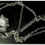 Ladies Quartz Necklace Watch with Filigree Design on Casing and Surrounded by 8 White-Silver Diamante Stones. Image 6