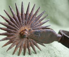 Antique handmade American wrought iron rider spores in western decor Americana rustic with original leather straps