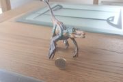 Papo Figurine of a Feathered Velociraptor Dinosaur