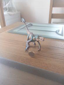 Papo Figurine of a Feathered Velociraptor Dinosaur