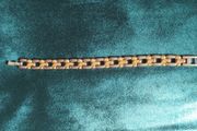 Two-tone metal bracelet.