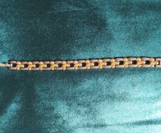 Two-tone metal bracelet.