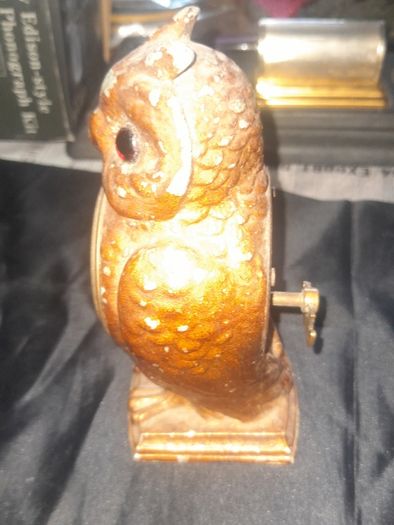Cold Painted Bronze Clock In Form Of An Owl. The Decorative Dial Sits In The Owls Belly And Has Wind Up Movement,