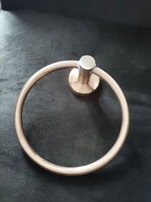 towel and paper holders on gold