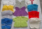 Handmade baby cardigans and dresses from newborn