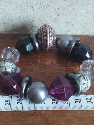 Vintage bracelet with purple beads.