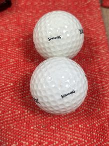 2 vintage Spalding golf balls