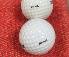2 vintage Spalding golf balls