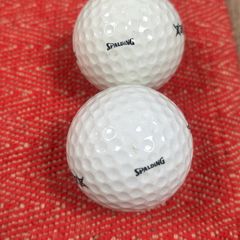 2 vintage Spalding golf balls