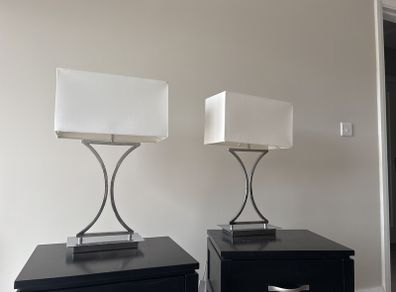 two silver lamps