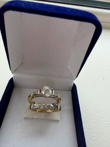 Engagement ring and diamond and gold wedding band