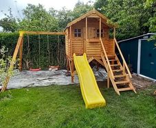 Wooden Treehouses with slide and 2 swings