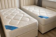 Cream single beds