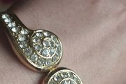 Beautiful gold-tone suit bracelet with crystals.