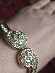 Beautiful gold-tone suit bracelet with crystals.